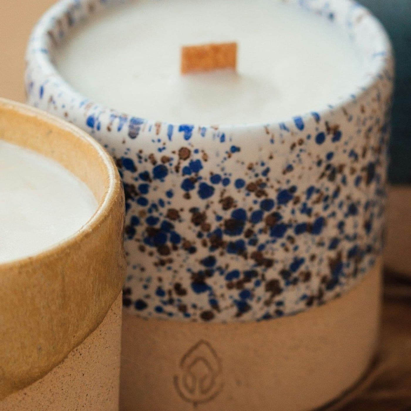 Lavender Serenity Candle — A wooden-wick candle in a white ceramic cup flecked with indigo glaze